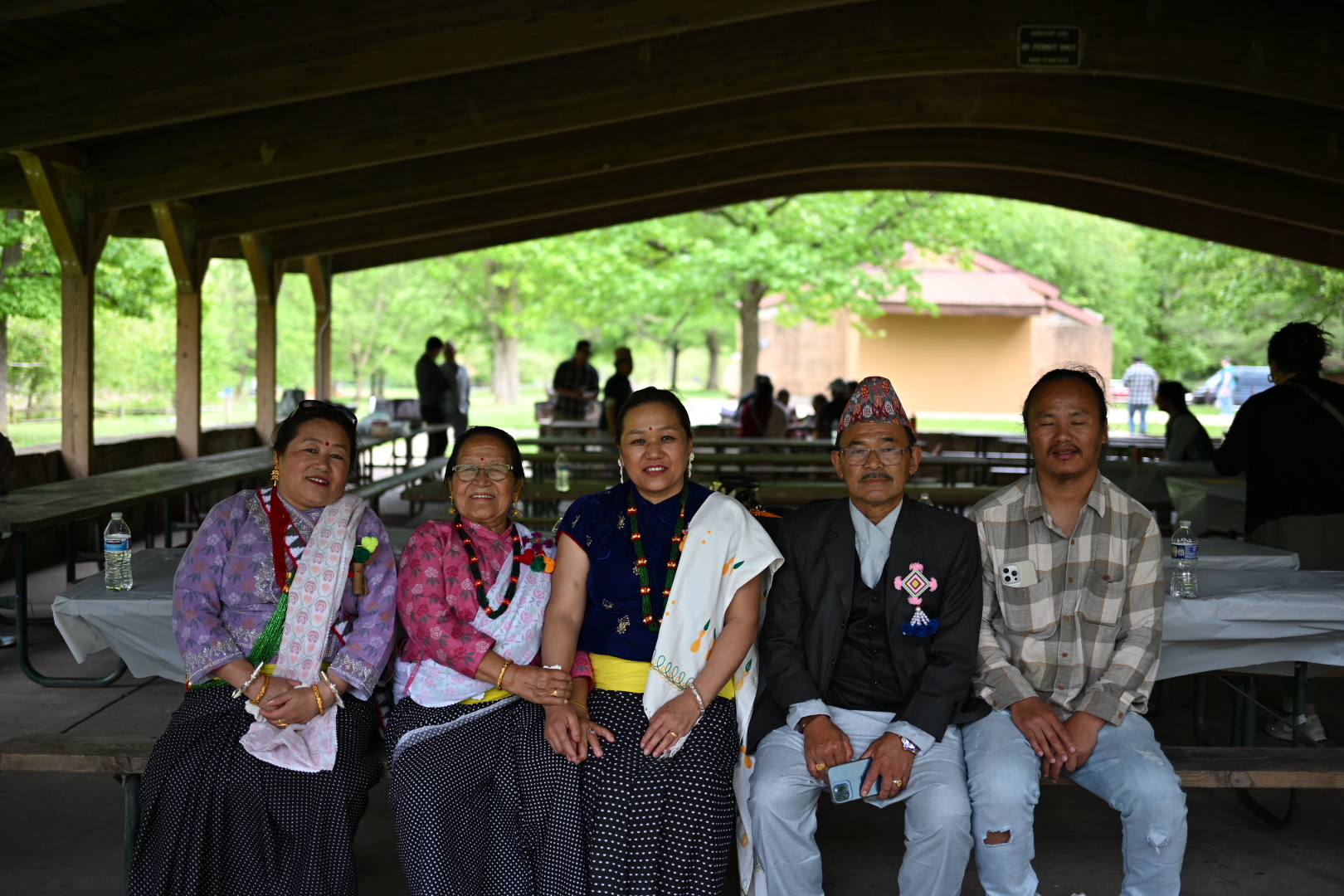Community elders and family members seated together