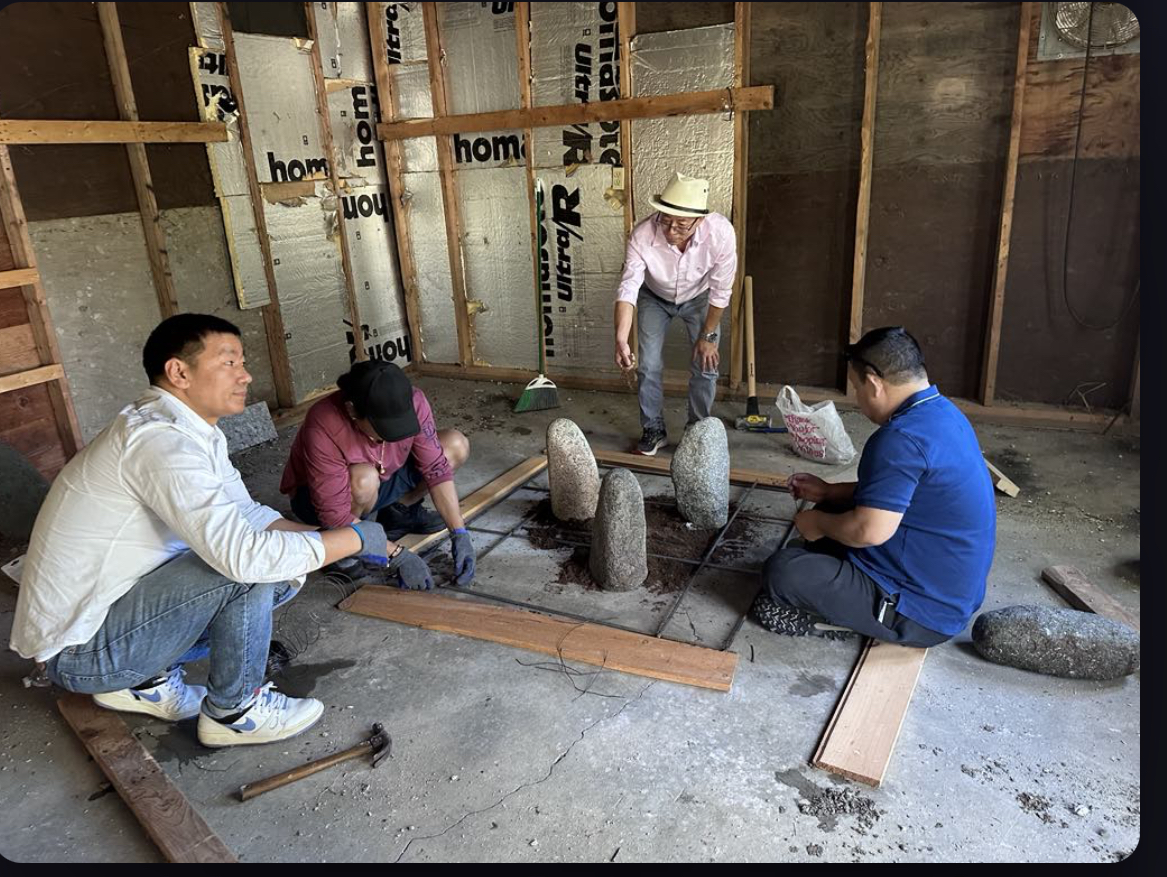 Community members establishing the sacred Chulaghar ancestor-worship space